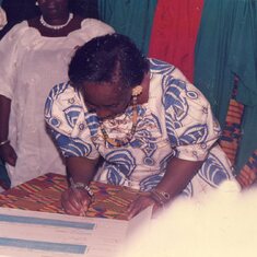 Grandma signing the paper work at Naa and Sammy's wedding in December of 1994.