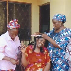 Agnes making sure Aunty Florence hair is properly braided_May20