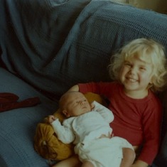 Ahja (age two and a half) holding little brother Adam