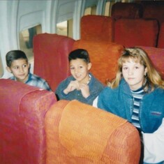 First time on a plane, flying to dad's for Christmas. With his brother and sister.