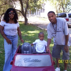 Aiysir with mom and dad 2006