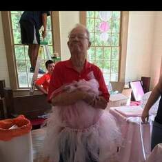Decorating for my wedding & he decided to wear the cake table skirt as a tutu!! 