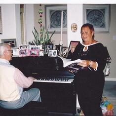 Gloria's 50th Birthday party. Julie singing with our Dad on piano. I lovely combination.