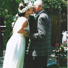 Micah with her Grandpa on her wedding day May of 2006. Stunning photo and a wonderful memory.