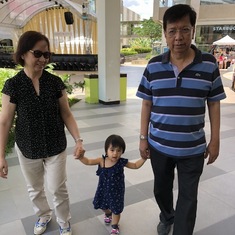 Papa and Mama brining Ela out to the mall.