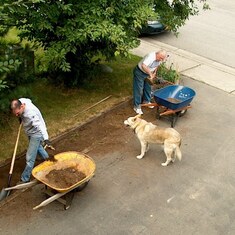 2004: Rand and Al preparing a flower bed. Dad loved helping out even when a guest of Mary and Rand in Alaska. He was up for it!