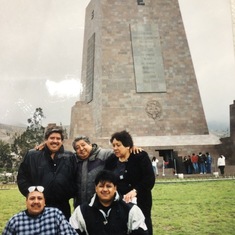 My dad with his siblings Guillermo, Anita, Gonzalo, and Quinty in Ecuador at la Mitad Del Mundo. Only two are alive today, the two he is hugging, Tio Coco and Tia Anita.