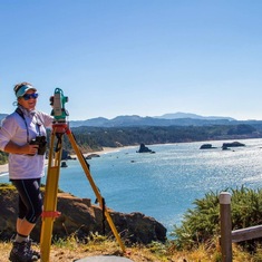 Alexa surveying for gray whales from shore using a theodolite in Port Orford, OR in 2017