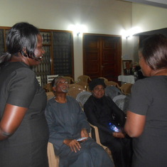 Prof and Mrs Atukwei Okai being briefed by the family