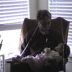 Dad asleep holding Eliana in 2000