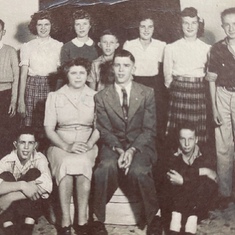 Al (seated lower right) and brother John (standing far right) at 4-H club.