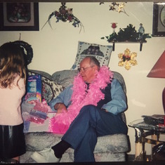 Papa rocking a boa and Katelyn (Christmas)