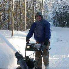 Snowblowing the drive in Soldotna, Alaska.  He even does it with a smile!
