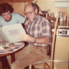 Dad with Kevin in 1980--Who's teaching who here?