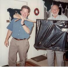 Dad was known for wrapping gifts in crazy ways. Here he is with Patti's husband Kevin.
