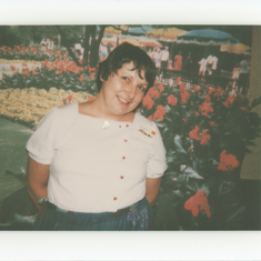 Mom and Flowers - not sure where, but this mid 80's when she worked in the camera department of Montgomery Ward.