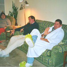 Alma is amused by my wearing of her beloved frog slippers.... i think this is Thanksgiving 2003 in Roswell, GA