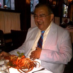 Alvaro enjoying a lobster in Boston