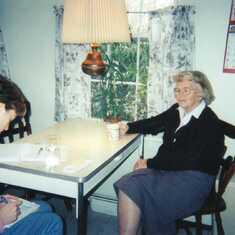 Feb. 2000 - Grandma at the kitchen table with Kira, busy planning her wedding