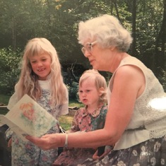 Oma reading to Georgia and Amy