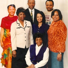 Mamie seated with her six children standing 
L-R Jennifer, Lorraine, Leonard, Maxine, Joseph and Eloine