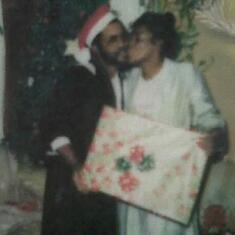 It was 7 of us. My Dad always made Xmas am fun. This was him and my mom. 