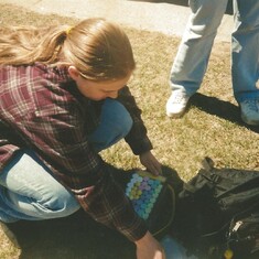 Squarebelly preparing her chalk writing adventure for the graduates at BSU-2003