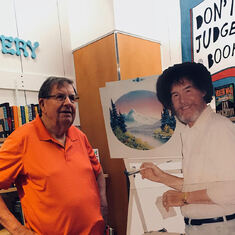 Dad waits for Bob Ross to paint some more happy little trees