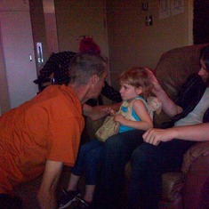 uncle Andrew  an his hands an d knees trying to get amy attention .