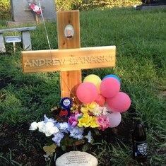 Andrew's gravesite on his 21st Birthday. This is the cross that we made until his headstone comes.