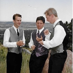 From Jim and Patti's wedding 6/23/01. Not sure what was at stake in the rock/paper/scissor here...