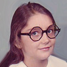 Angie, wearing the infamous stop-sign glasses @ 13 yrs. old