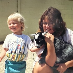 Showing cousin Kira farm animals approx 1990.