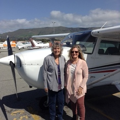 Anne giving her sister Kathy a flying lesson on her birthday.