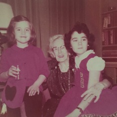 Anne on the left with cousin Kathy and great grandmother Nannie.  Christmas 1957.  Photo courtesy of Kathy McGovern.