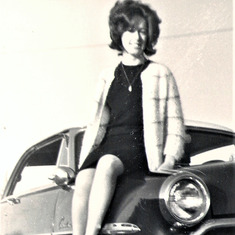 Annie sitting on Vince's 1952 Ford in 1964