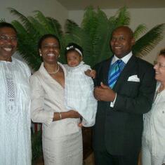 Standing with my late, Dear Uncle Frank and Auntie Alice, along with Uncle Nnamdi and me as the proud god parents of Manuela.