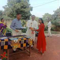 Giving scholarship at ancestral village