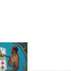 Anthony in the pool with Kayla when she was a baby