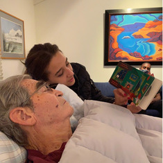 Jazmine reading Good Night moon to Grandpa