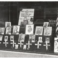 photo of display of fallen WW2 vets- Art is second from left on bottom row