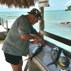 Captain Arthur cleaning fish