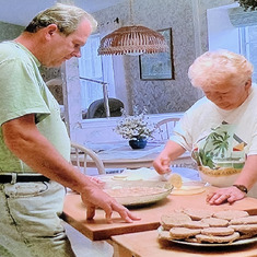 An iconic photo of Betty and Art cooking together