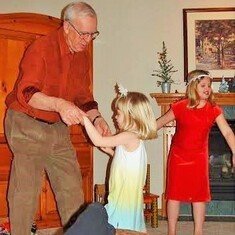 Arvin loved to dance!  Here he is with granddaughters Amanda and Emily at son Brent's house.