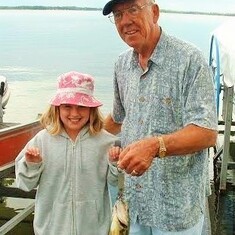 Proud grandpa Arvin, fishing with granddaughter Emily at his lake home.