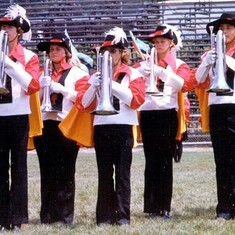 Arvin's youngest son, Brent (left), performing with the Geneseo Knights Drum & Bugle Corps.