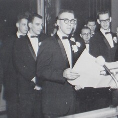 First Commander of the new Sigma Nu fraternity - Arvin - receives the granting of the Sigma Nu charter.  His brother, Alden, is standing behind him (slightly to the left).