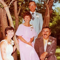 25th wedding anniversary with their attendants - maid of honor, Barb Muller, and best man, Alden.