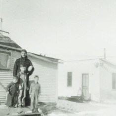 Another view of the shanty with Adolph and his three boys (1943).  It cost $300 and was added onto at least 3 times.
