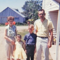 Bev, Cindy, Allan & Arvin at his parents' home in Grenora, ND (1963).